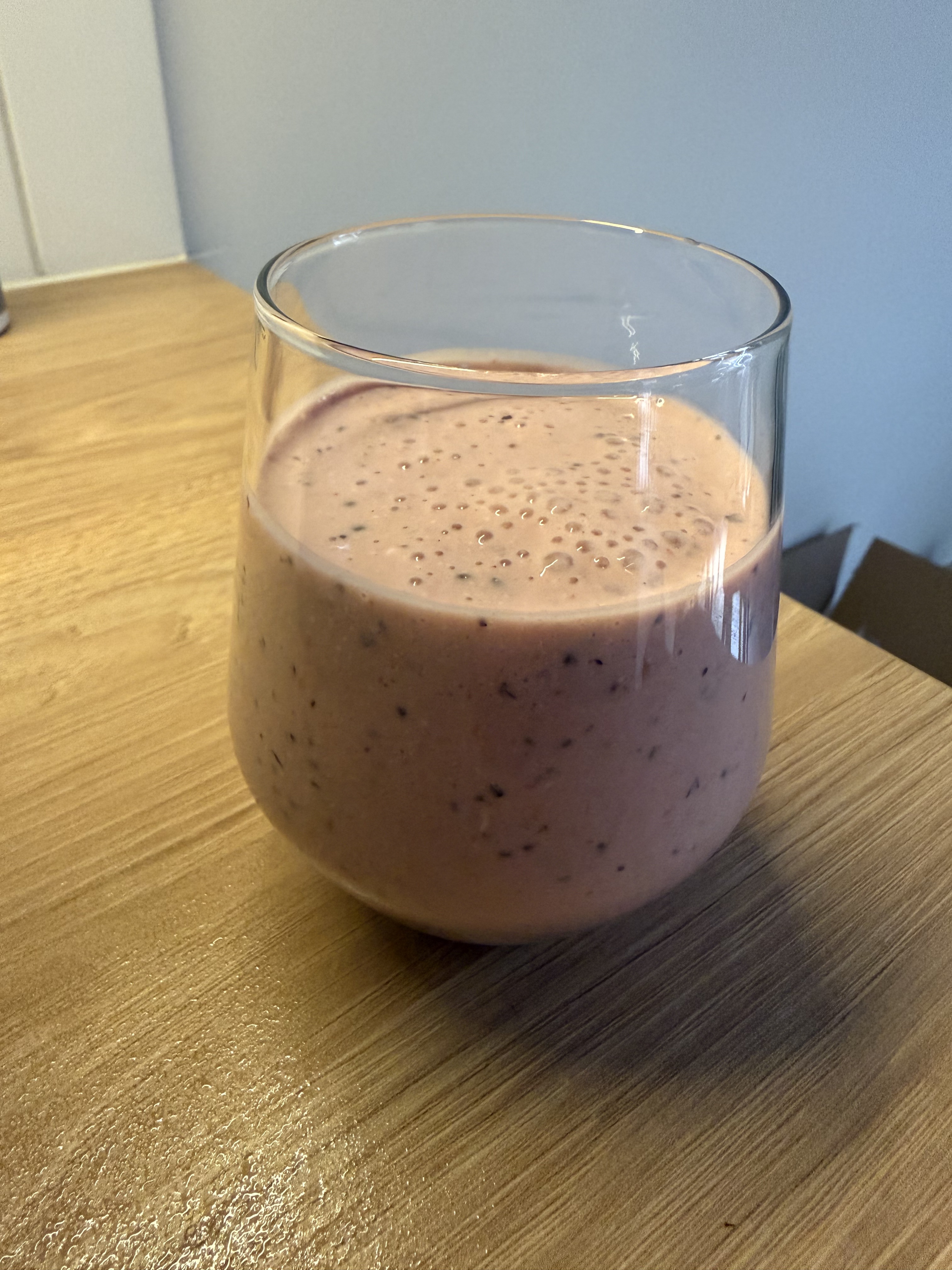 Breakfast smoothie on 2026-07-21: pink berry smoothie in a glass with visible berry specks