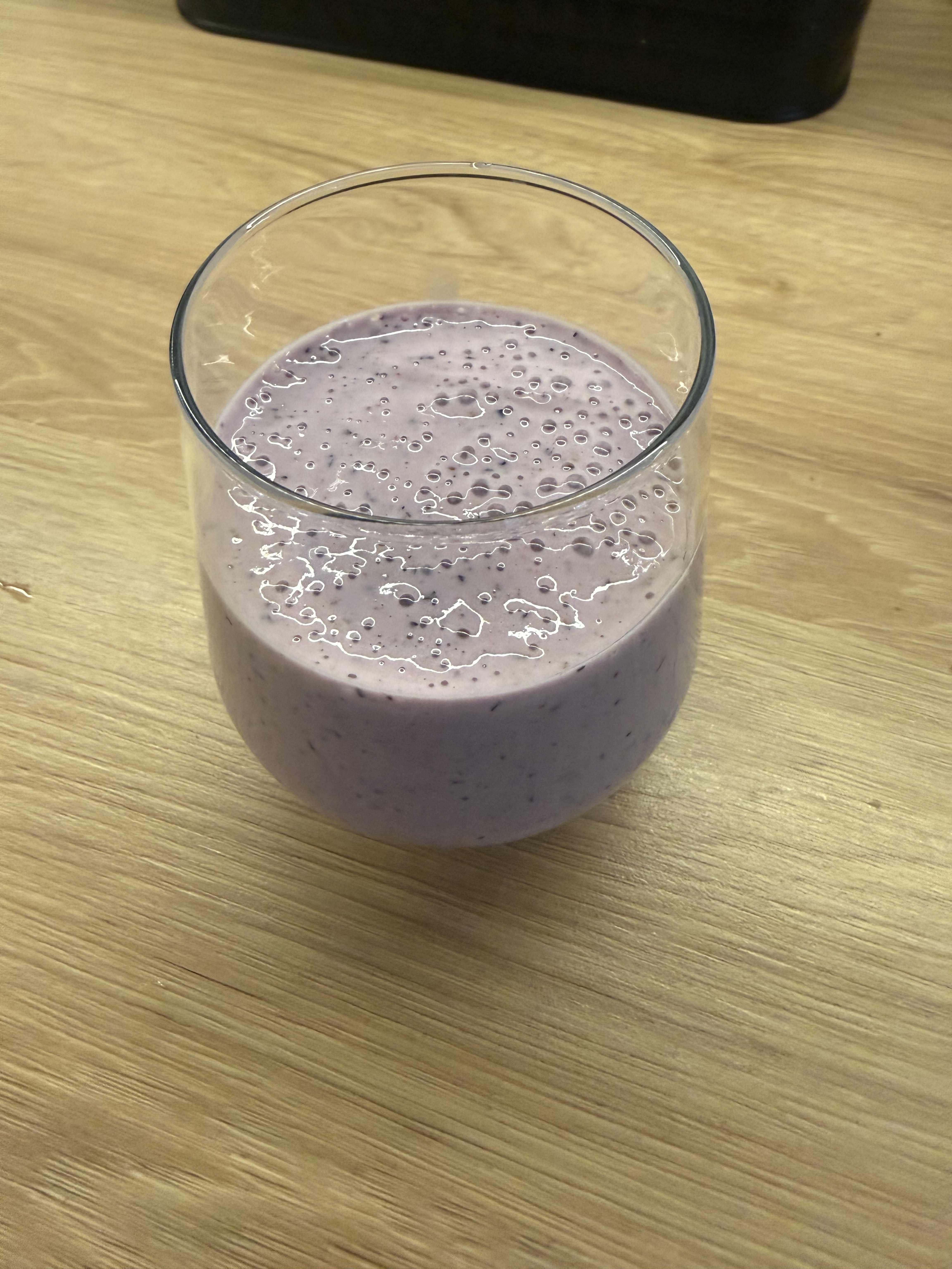 Breakfast smoothie on 2026-07-26: a blueberry and strawberry smoothie with kefir, cottage cheese, banana, chia, and protein powder in a glass